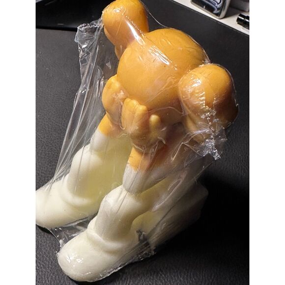 KAWS - (sitting covering face) - Yellow and White CANDLE - Picture 3 of 5